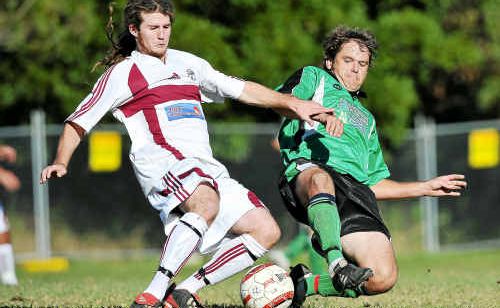 Boambee’s James Heath and Maclean captain Kevin Crofton fight for possession. Boambee’s James Heath and Maclean captain Kevin Crofton fight for possession.